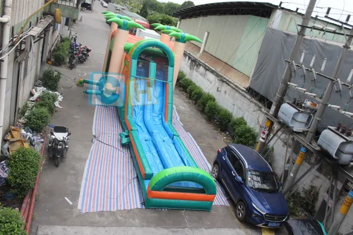 Inflatable water slide with blower