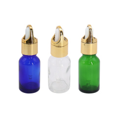 Color Clear Glass Dropping Bottles for sale , Golden Cap Dropper Bottle for Hair Essential Oil