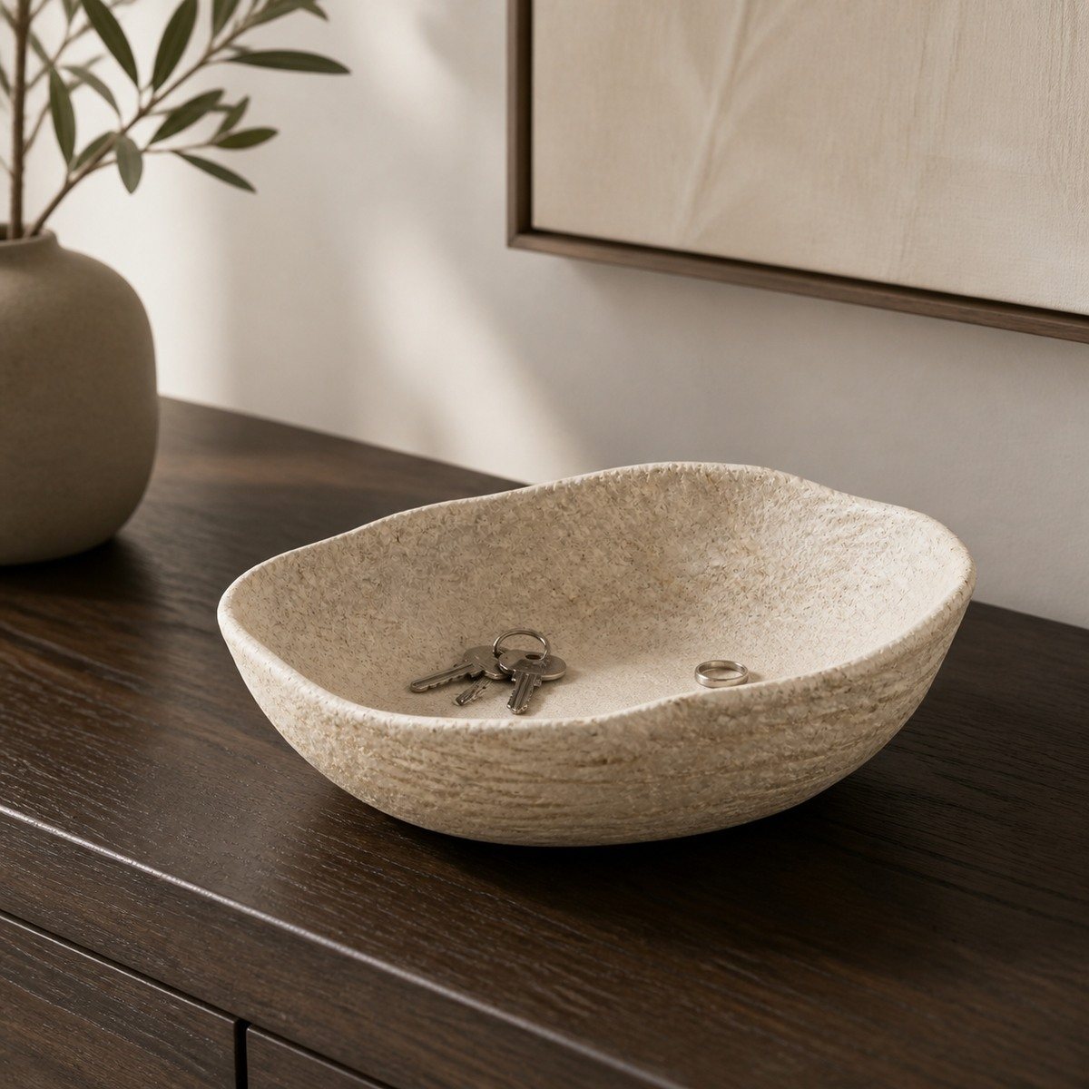 Terra Fold recycled-fiber catchall holding keys and a ring on a dark oak console