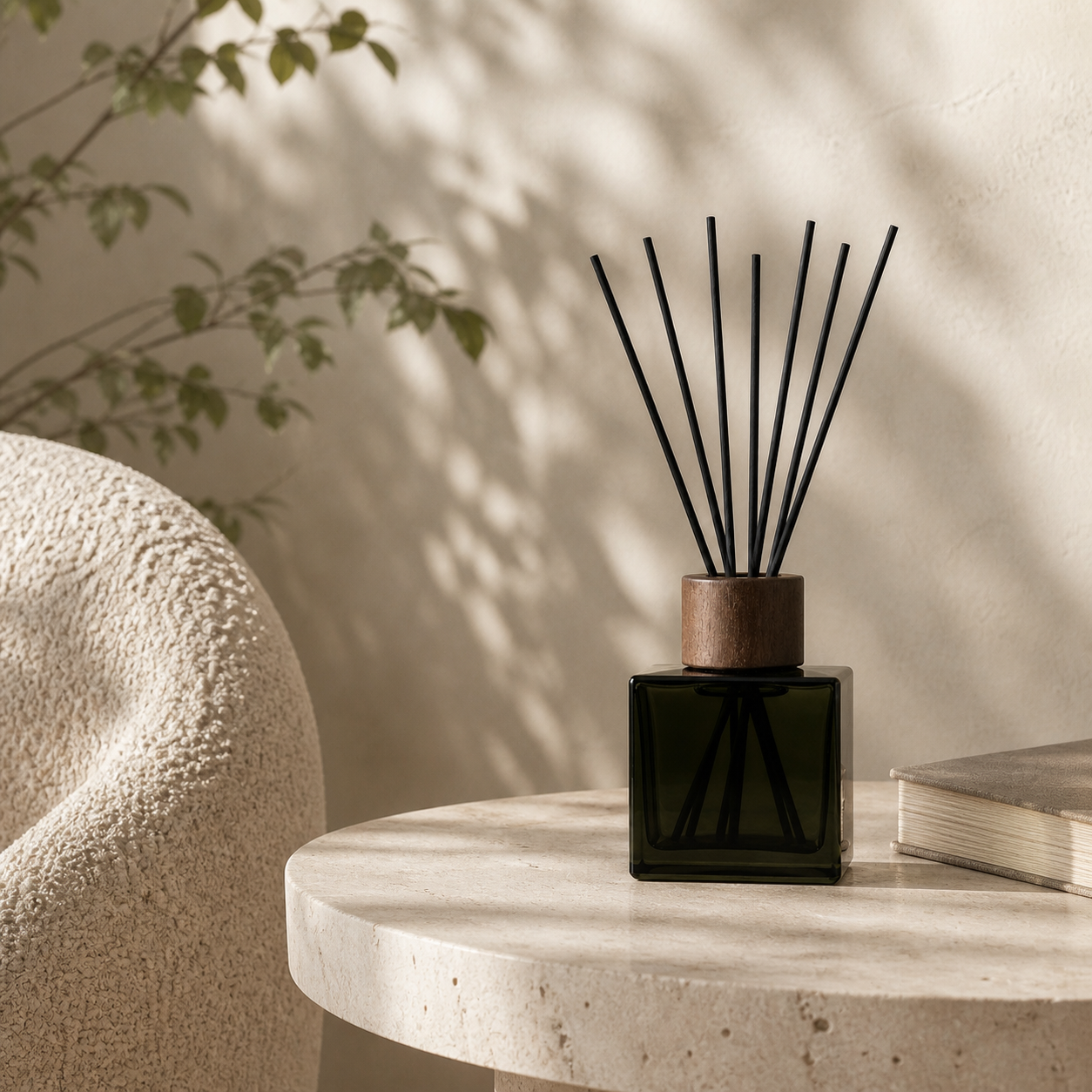 Verdant Haze reed diffuser styled on a travertine side table