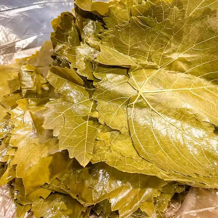Vine leaves Grape leaves in glass jar/in drum/in Barrel