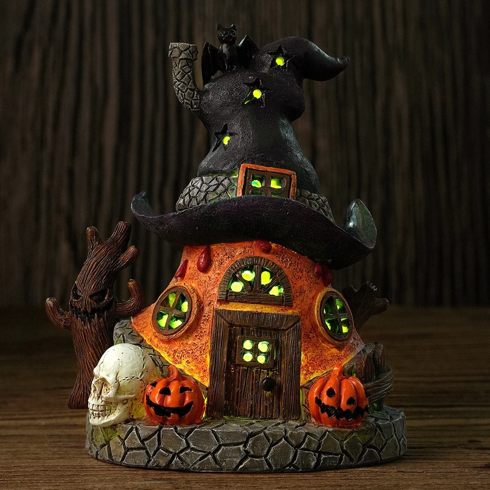 Wholesale innodept12 Halloween witch hat house with LED lighted windows, spooky pumpkins, and skull details.