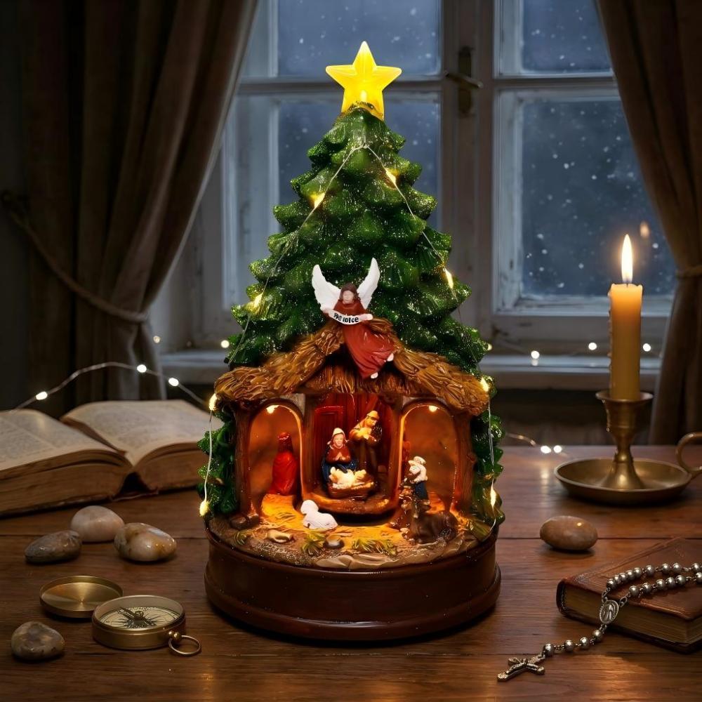Illuminated Nativity Christmas Tree diorama with spinning figures, on a holy desk with religious texts and prayer rope.