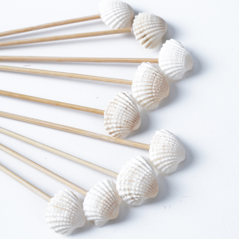 Each pack contains 100 white shell bamboo sticks and 4.7-inch disposable fruit sticks for a summer beach party