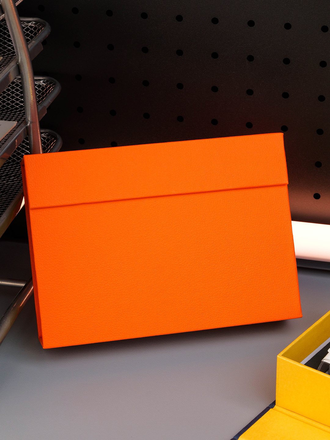 Plain orange textured gift box with a flap closure