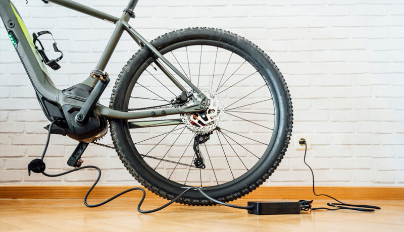 Can I turn my e-bike on while charging?