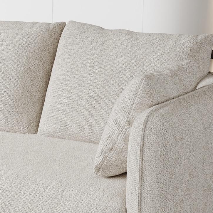 Modern minimalist living room: fabric sofa and artistic decoration
