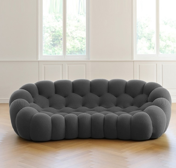 Italian minimalist football sofa: a lazy space outlined by curved lines