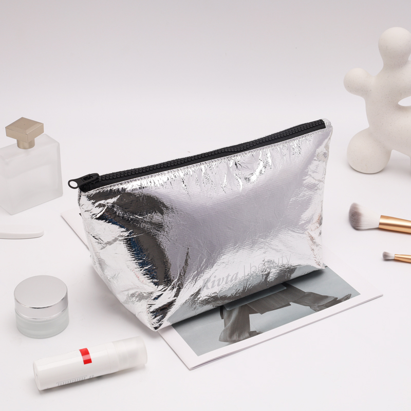 Silver Tyvek cosmetic pouch used as a material and scale reference for a custom drawstring RFQ