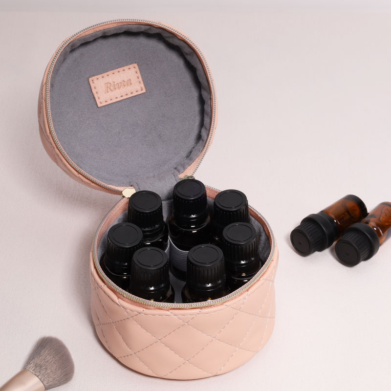 Quilted recycled PU essential-oil pouch opened with bottles for filled-kit fit review