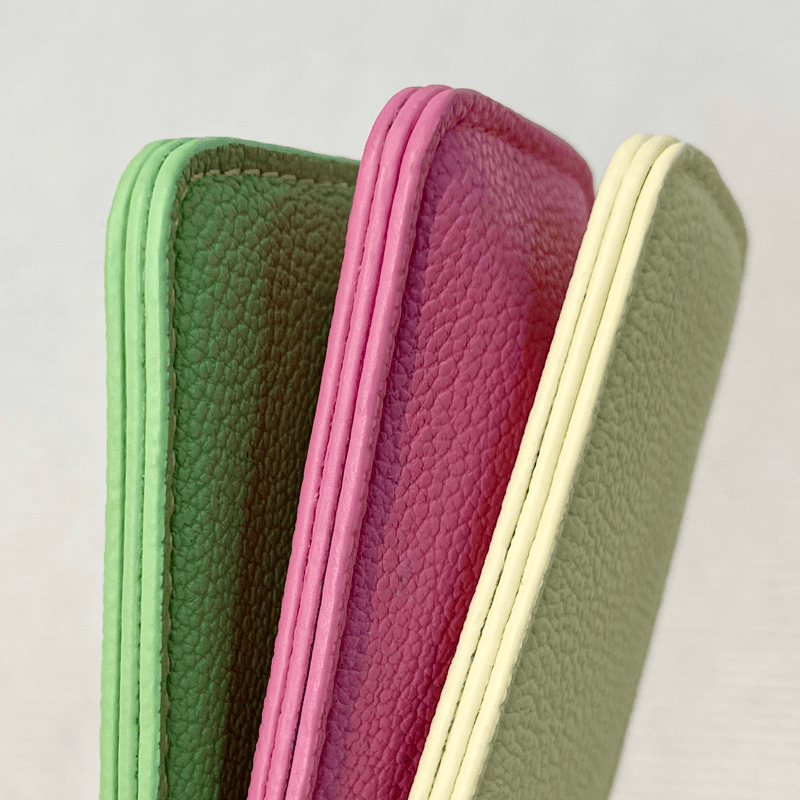 Close-up detail of Edge Painting on a PU leather cosmetic bag