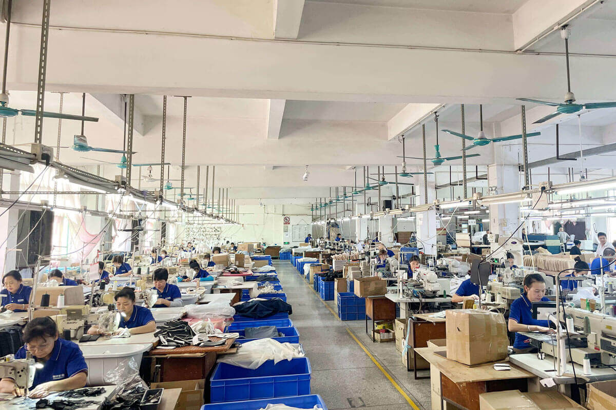 A factory floor showing workers and quality control processes