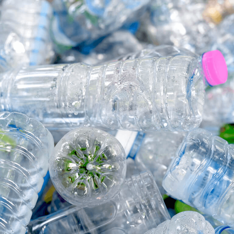 Post-consumer PET bottles are collected and sorted and cleaned