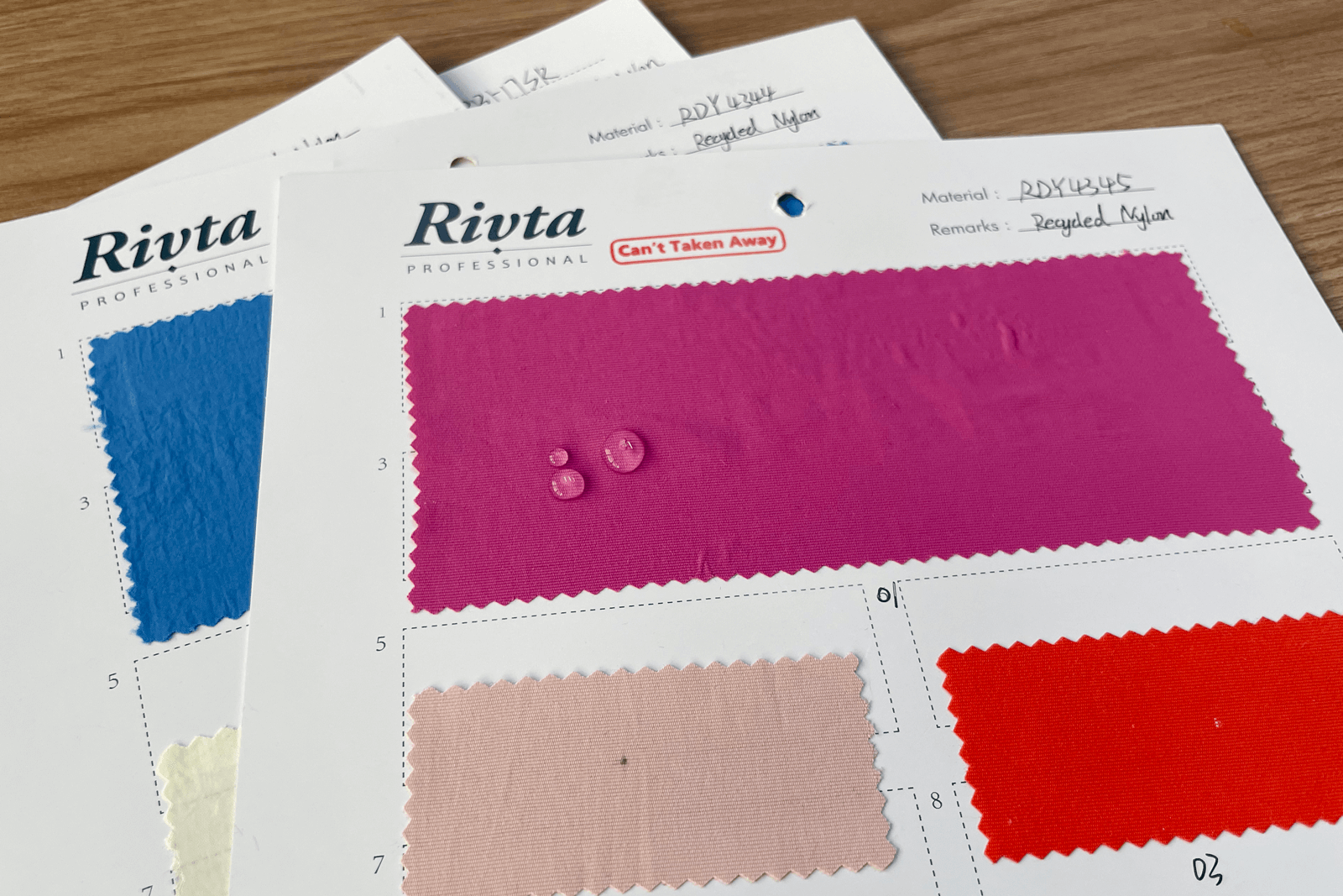 Water resistance test showing water droplets on recycled nylon fabric surface