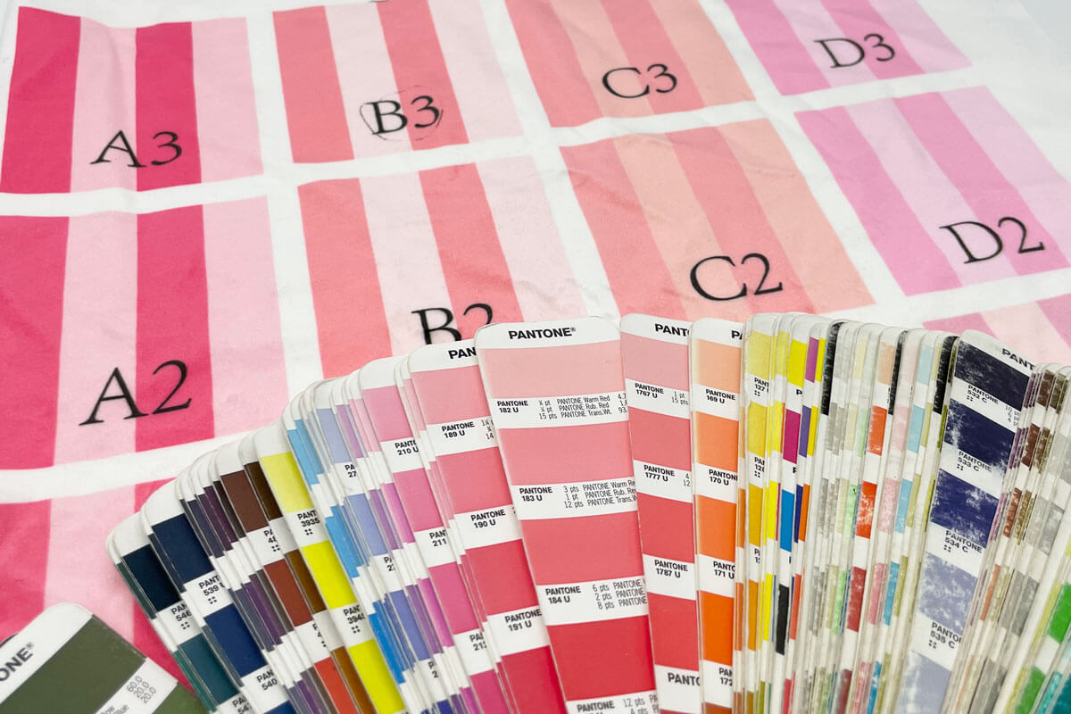 Pantone color fan deck matched perfectly with custom-dyed recycled fabric