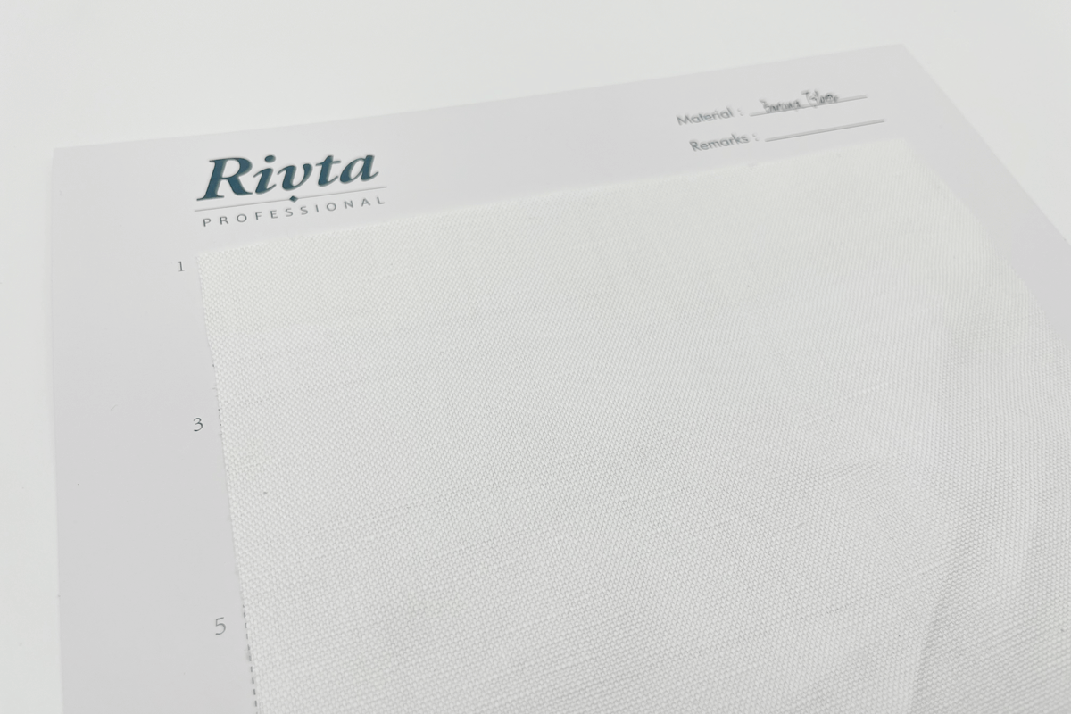A close-up of banana fiber fabric showing its unique, slightly coarse weave and natural sheen.