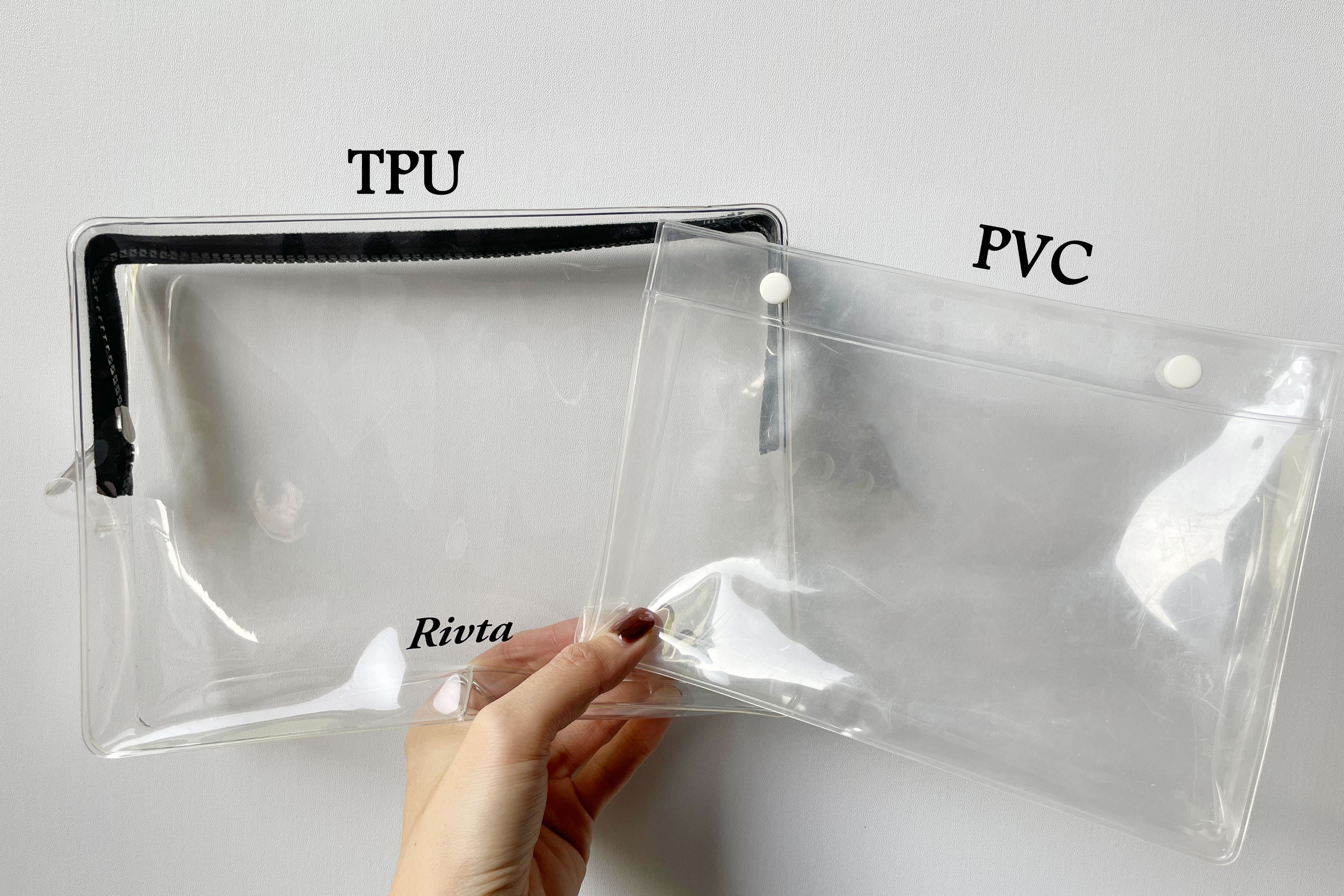 A side-by-side comparison shot in Rivta's studio: A clear, yellowing old PVC bag vs. a crystal clear, soft Rivta TPU bag. Or a sleek black Recycled Nylon bag with a 'Recycled' tag.
