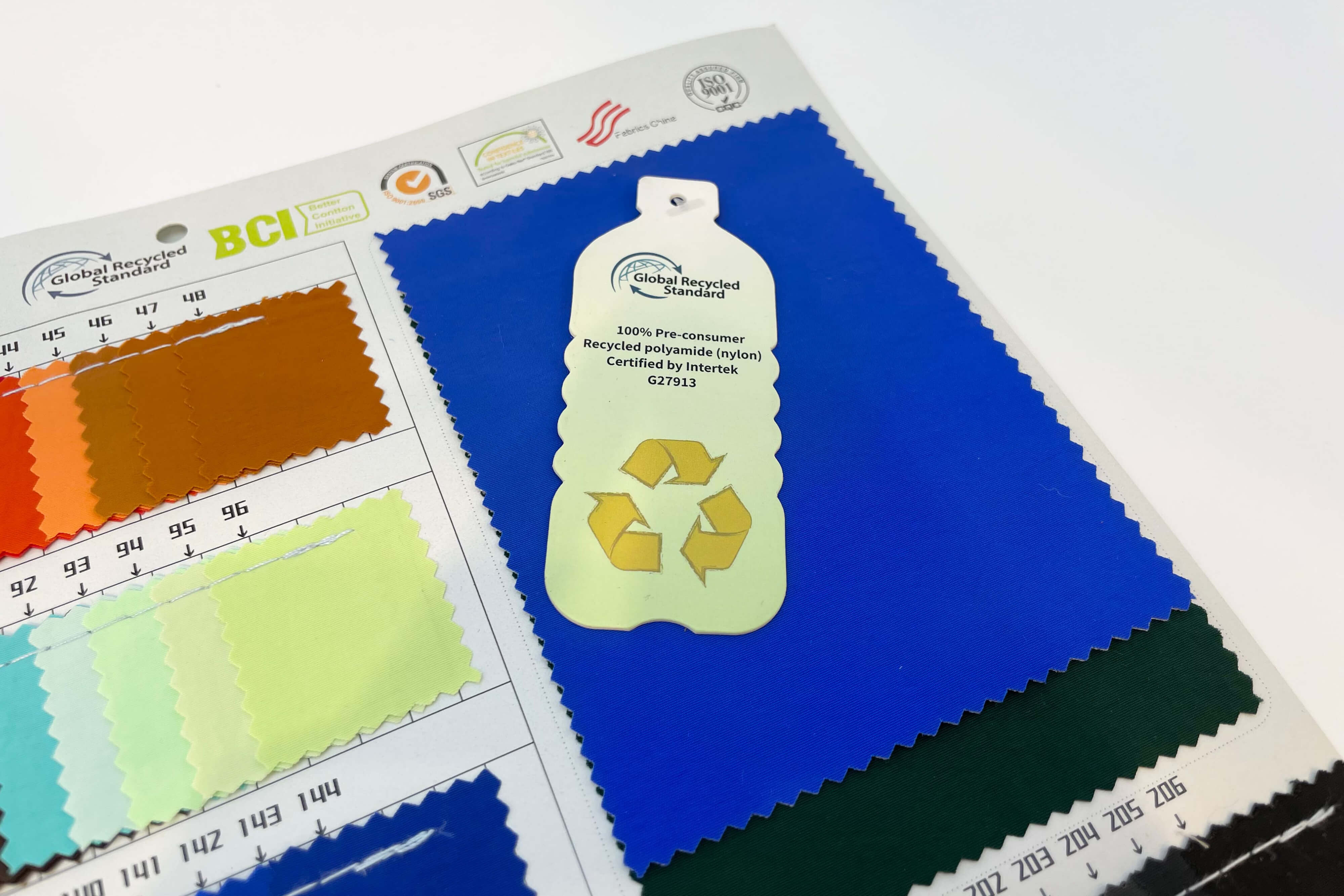 Close up of GRS and BSCI certification logos on a fabric tag