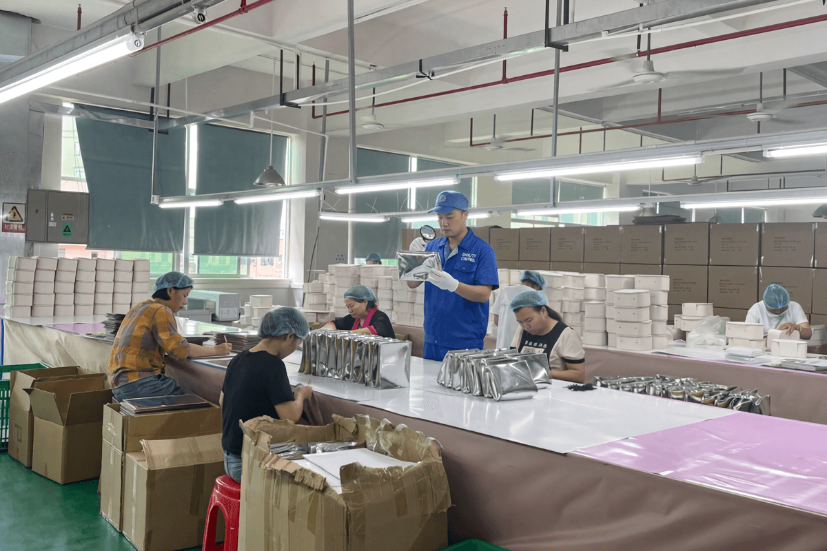 Rivta factory manager conducting a quality control inspection on makeup bags
