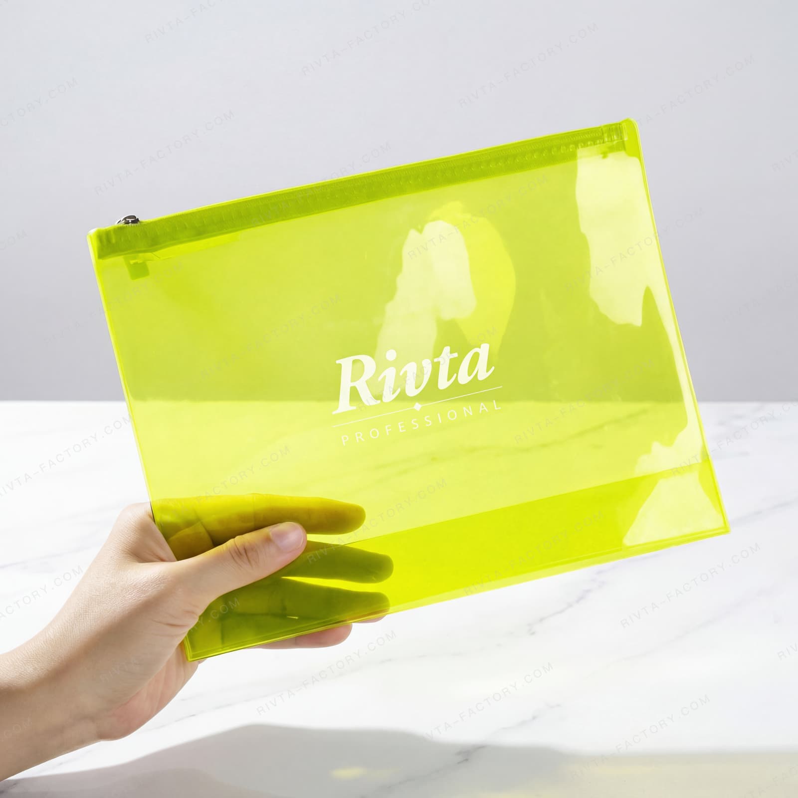 Hand-held green-tinted TPU cosmetic pouch with a top zipper for film and sample review