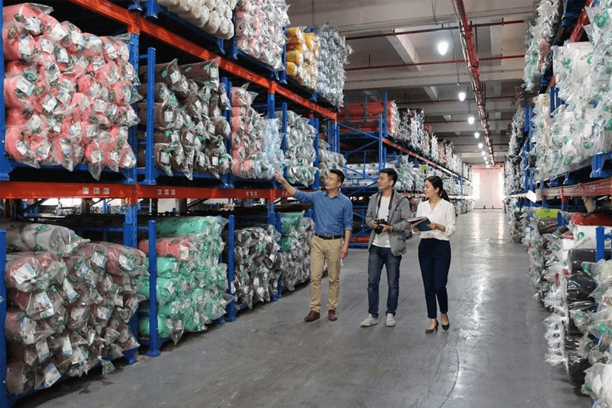 Factory audit and on-site inspection scene at a manufacturing facility.