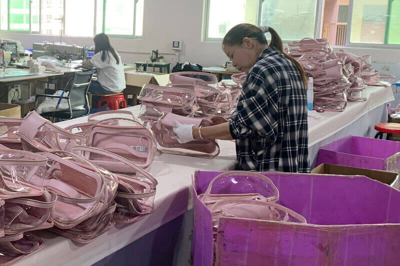 Clear cosmetic bag quality control inspection before compliance approval and bulk production