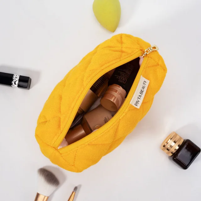 Wellness pouch packed with small bottles and beauty contents