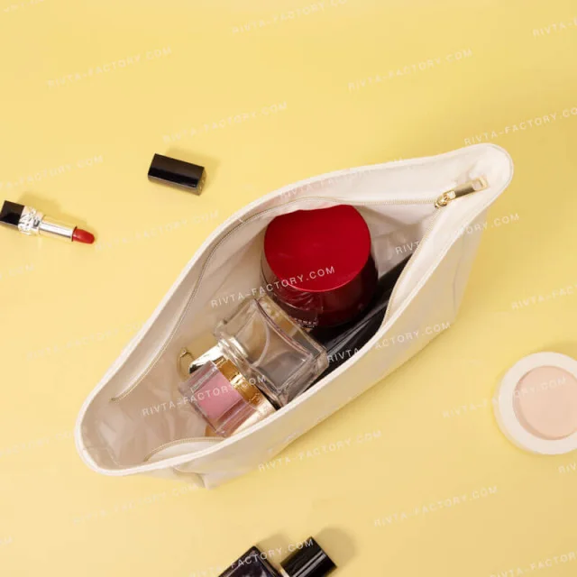 Soft textile toiletry pouch checked with small cosmetic contents