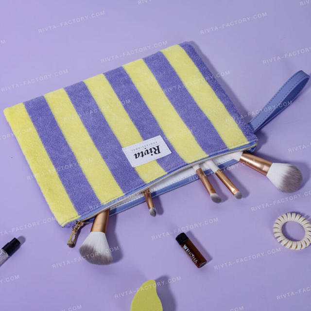Cotton towel spa toiletry bag checked with cosmetic contents