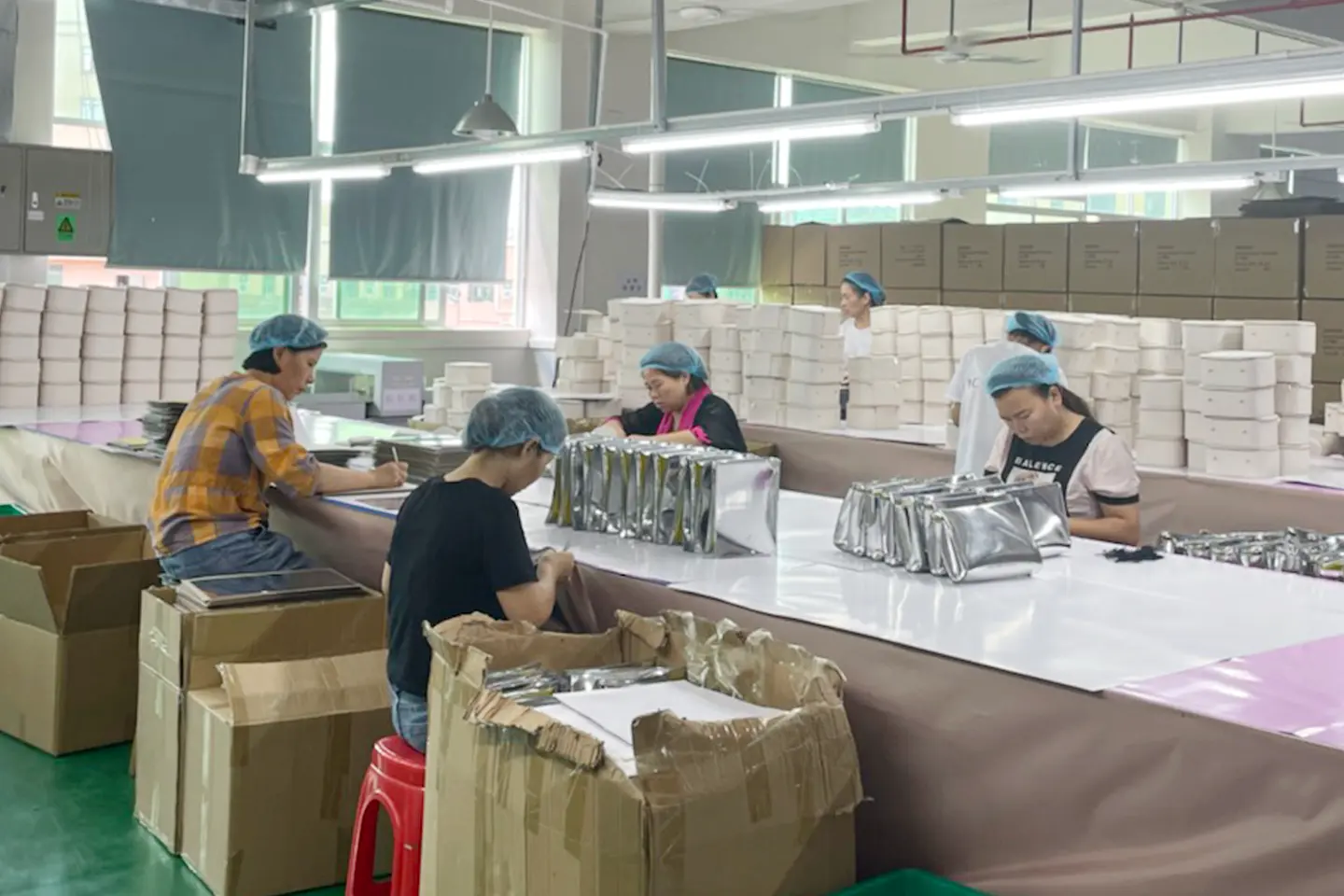 Zipper hardware logo and final appearance check at Rivta Dongguan factory