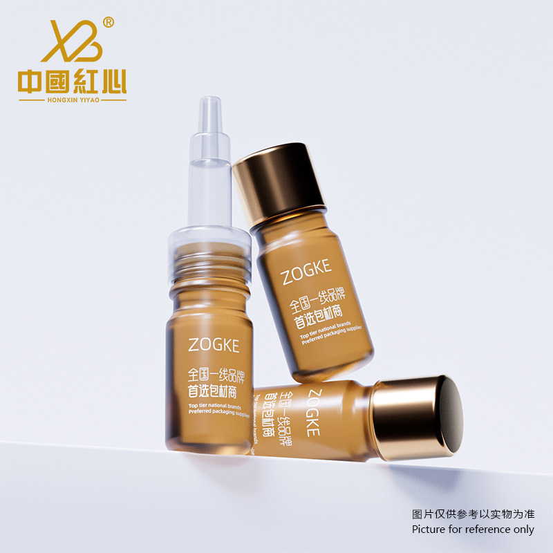 Tea-colored essential oil sample dispensing bottles