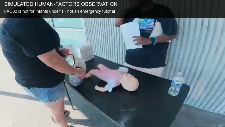 Still from FAC02 equipment preparation observation beside a small training manikin, with age restriction caption