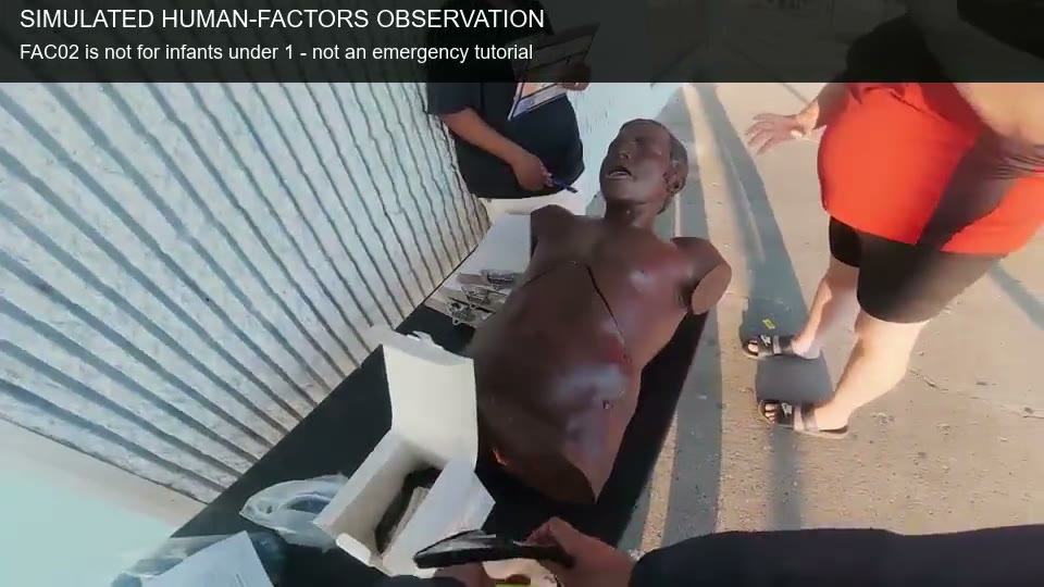 FAC02 simulated handling beside an adult manikin; safety caption explains footage is not a clinical rescue