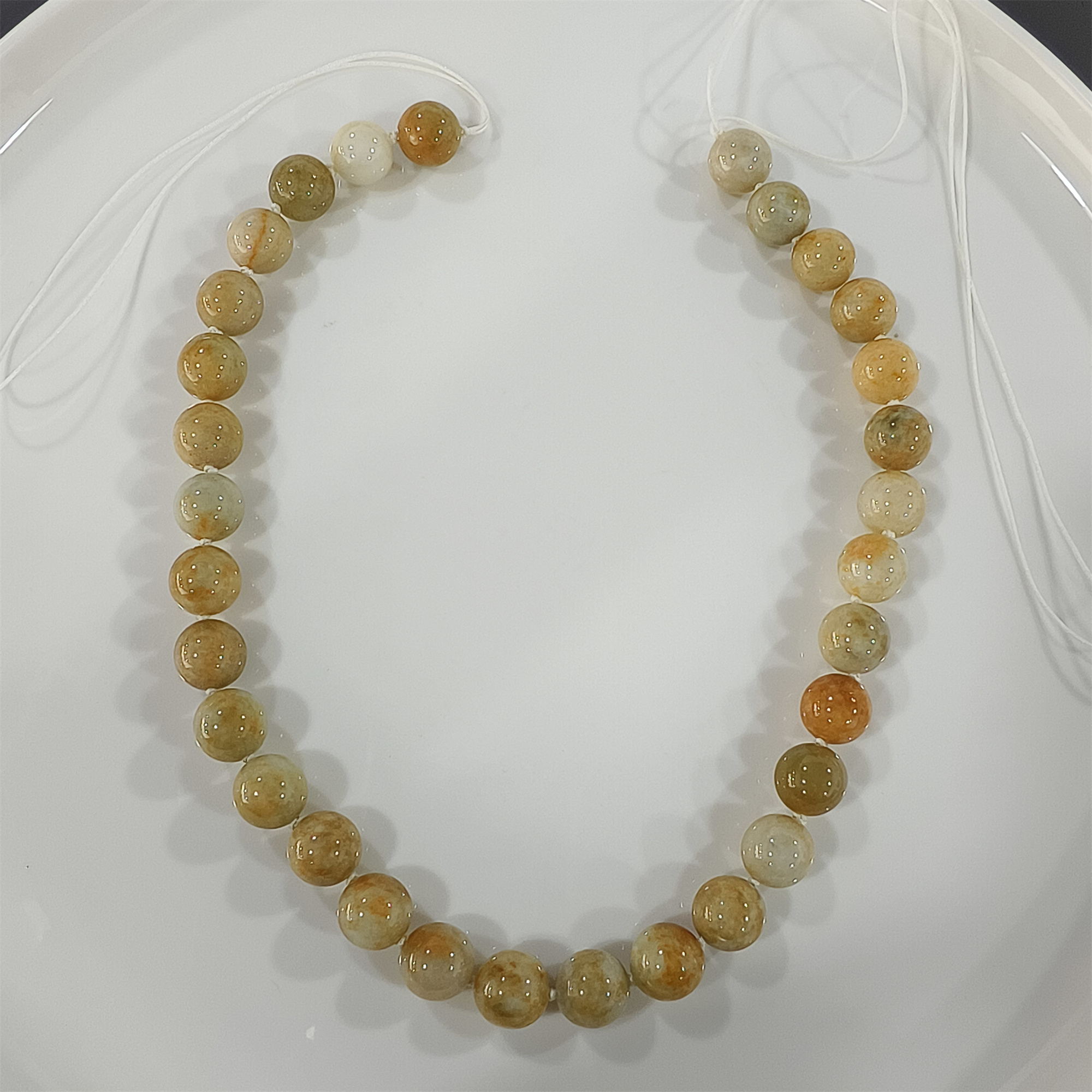 Custom order: 10 strands of green jadeite beads (processing fee included) and 5 strands yellow jadeite beads labor fee