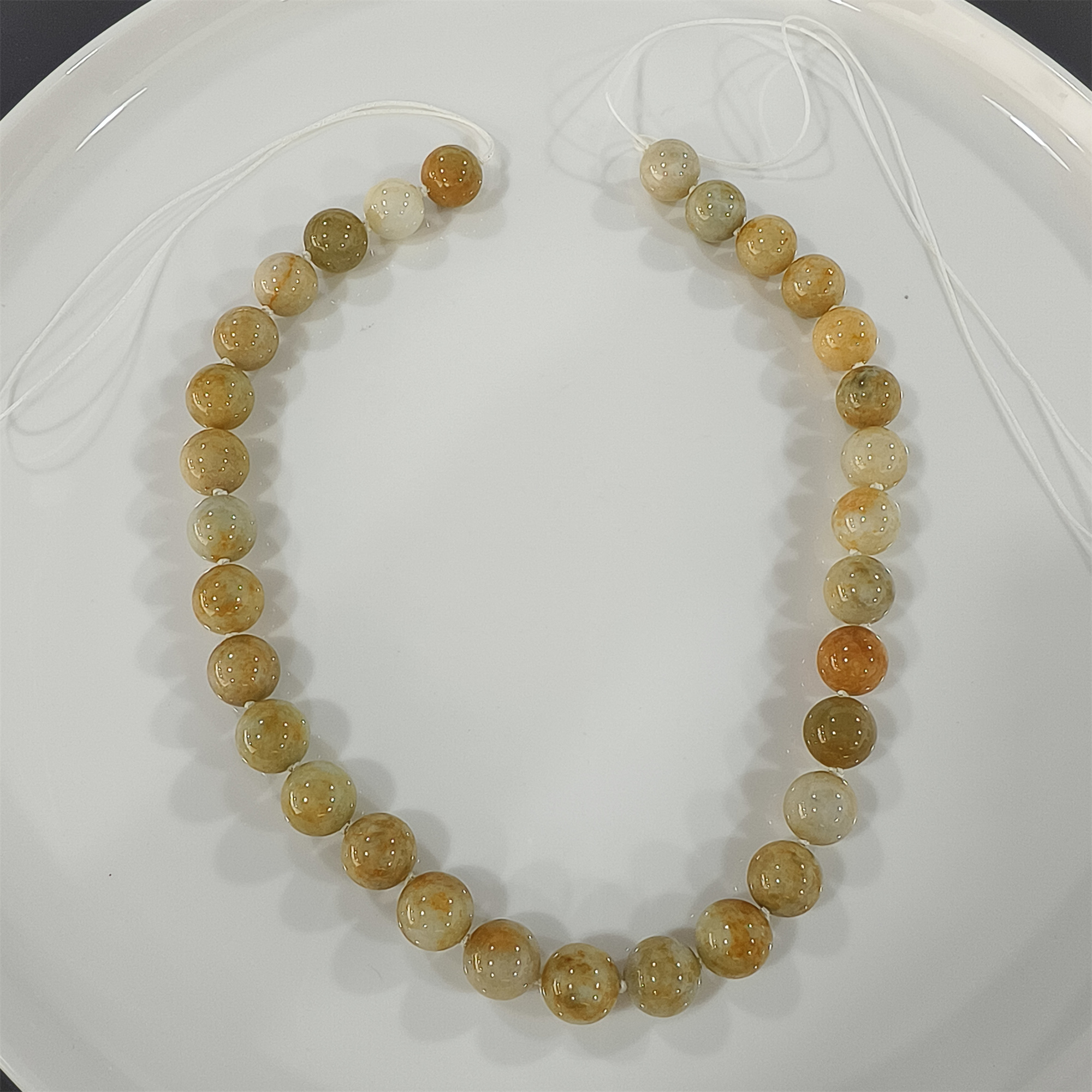Custom order: 10 strands of green jadeite beads (processing fee included) and 5 strands yellow jadeite beads labor fee