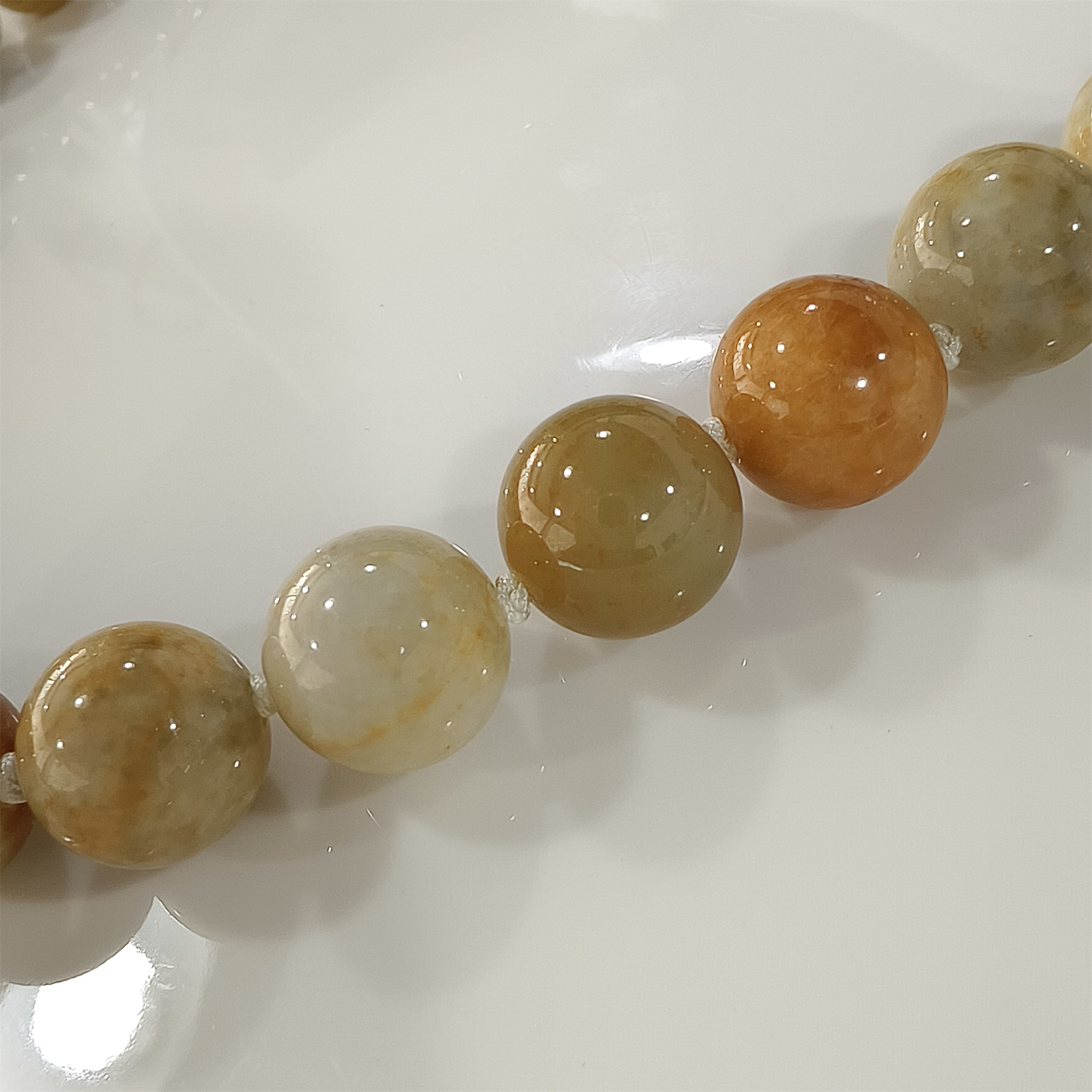 Custom order: 10 strands of green jadeite beads (processing fee included) and 5 strands yellow jadeite beads labor fee