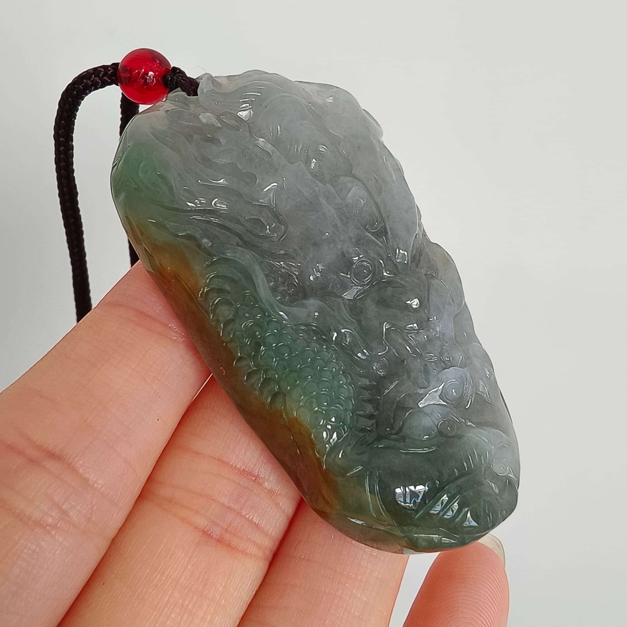 DDP 55mm Natural Certificated Icy Blue Yellow Gray Guatemalan Jadeite Dragon Pendant