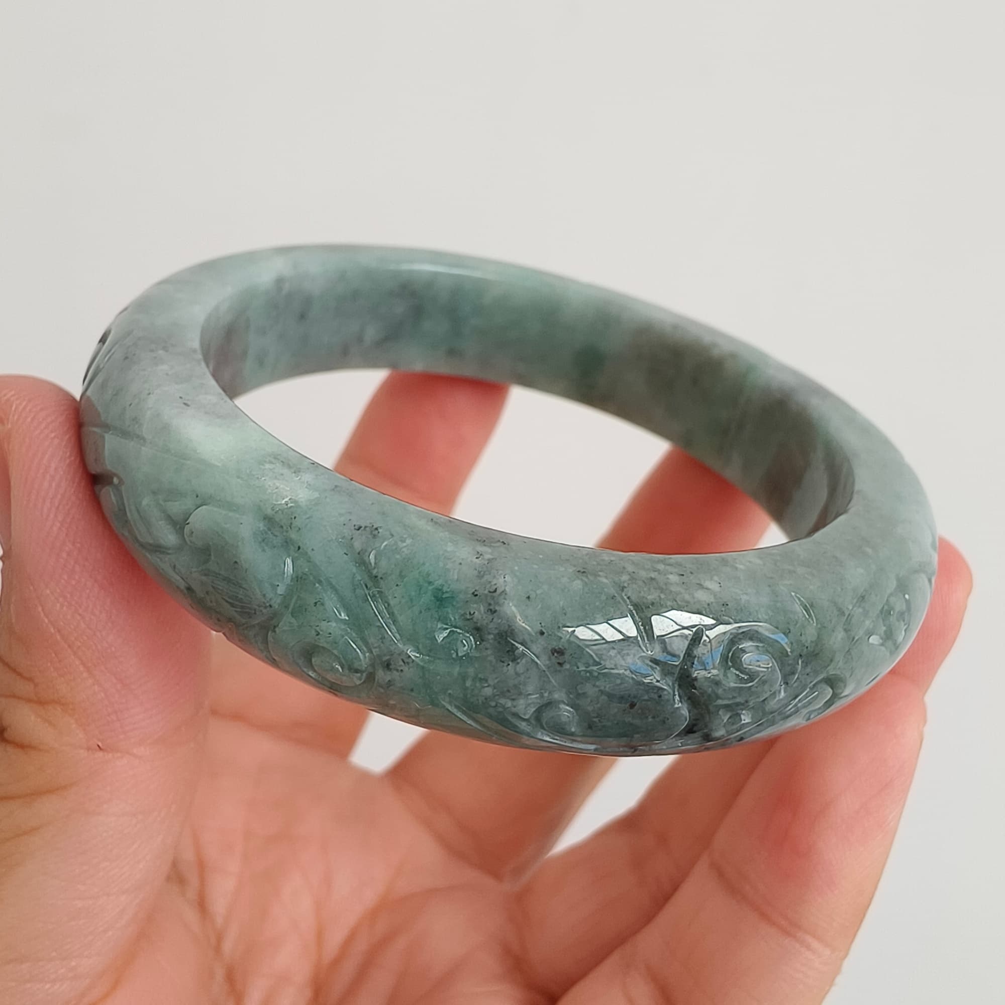 DDP 56mm Natural Type A Black Chicken Species Burmese Jadeite Round Band Bangle With Ruyi Carved
