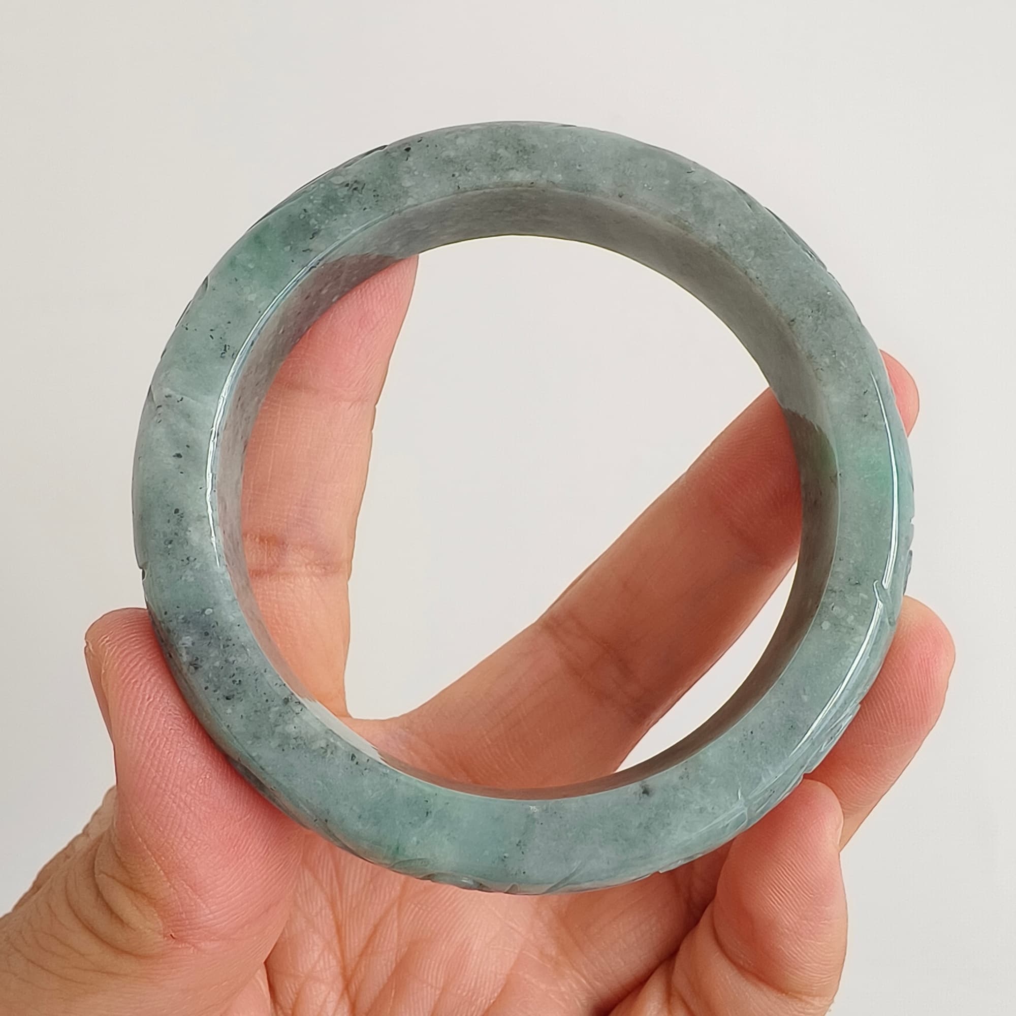 DDP 56mm Natural Type A Black Chicken Species Burmese Jadeite Round Band Bangle With Ruyi Carved
