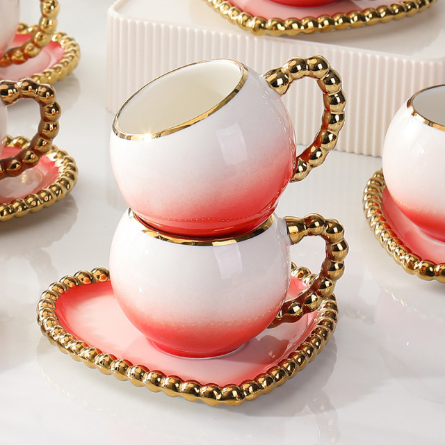 heart-shaped coffee cup and saucer set