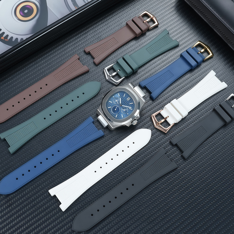 Rubber watch straps in several colours around a chronograph watch