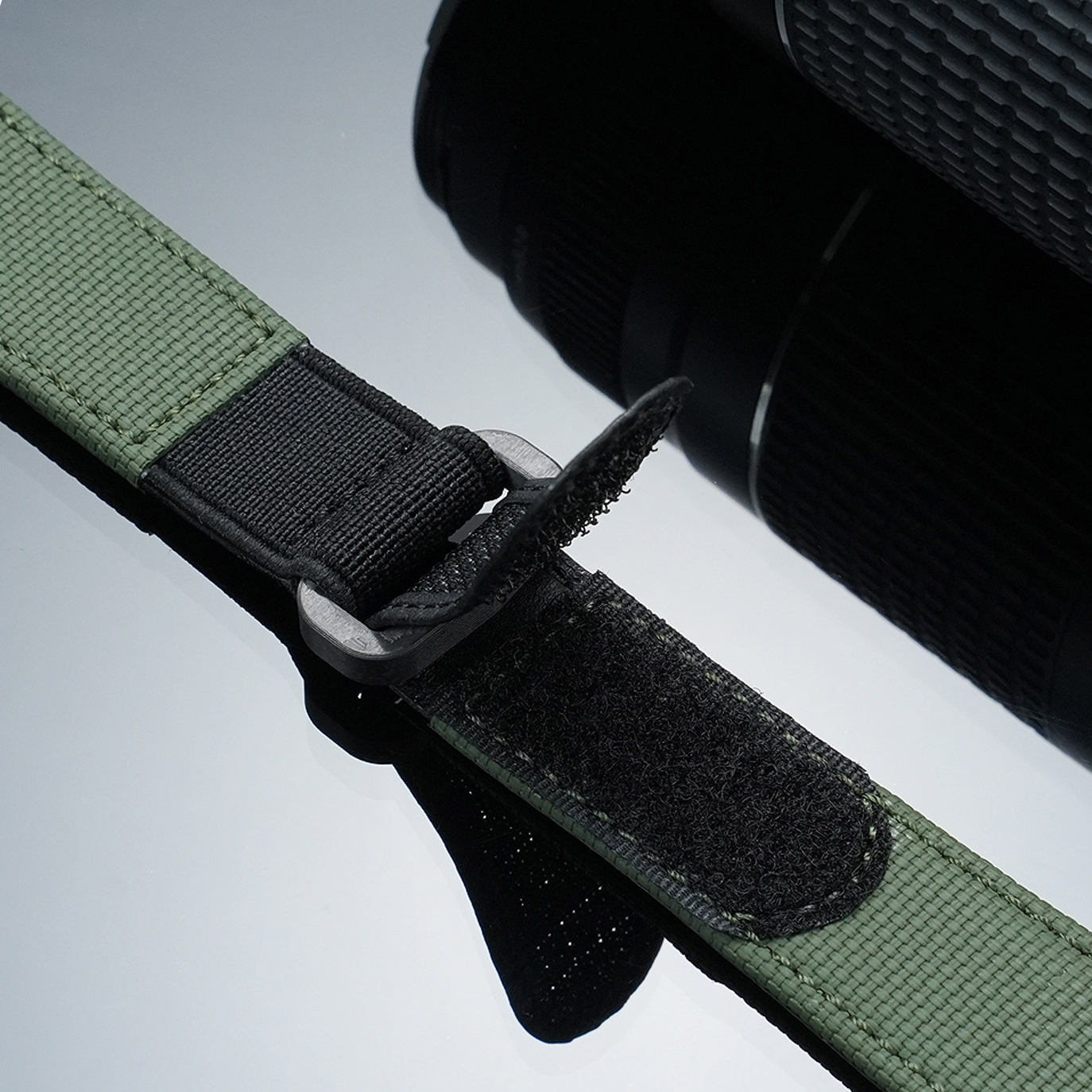 Olive green woven nylon strap with black hook-and-loop closure