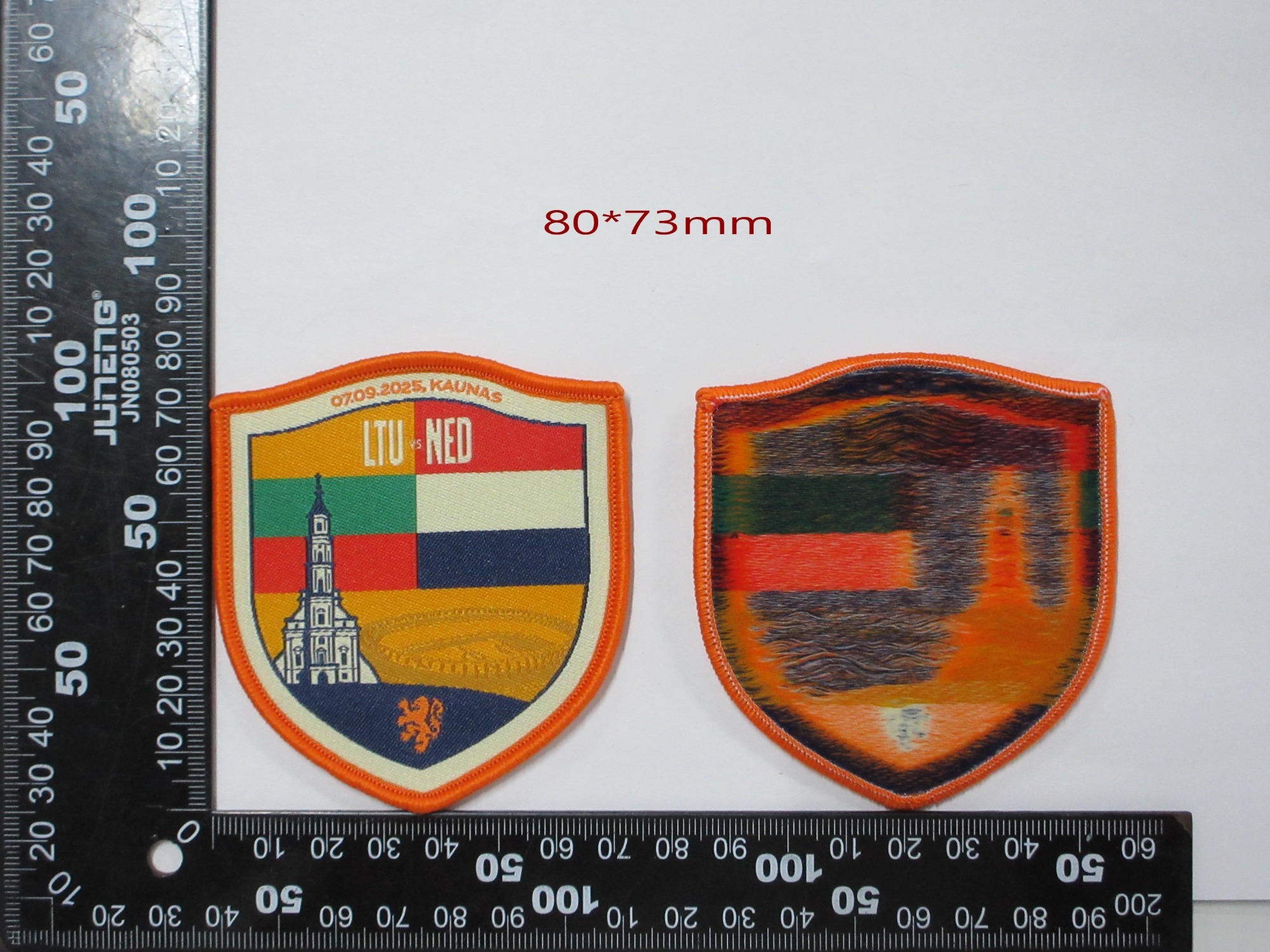 Custom Shield-Shaped LTU-NED Kaunas Woven Patch (80x73mm) with Merrow Border - Reference Design