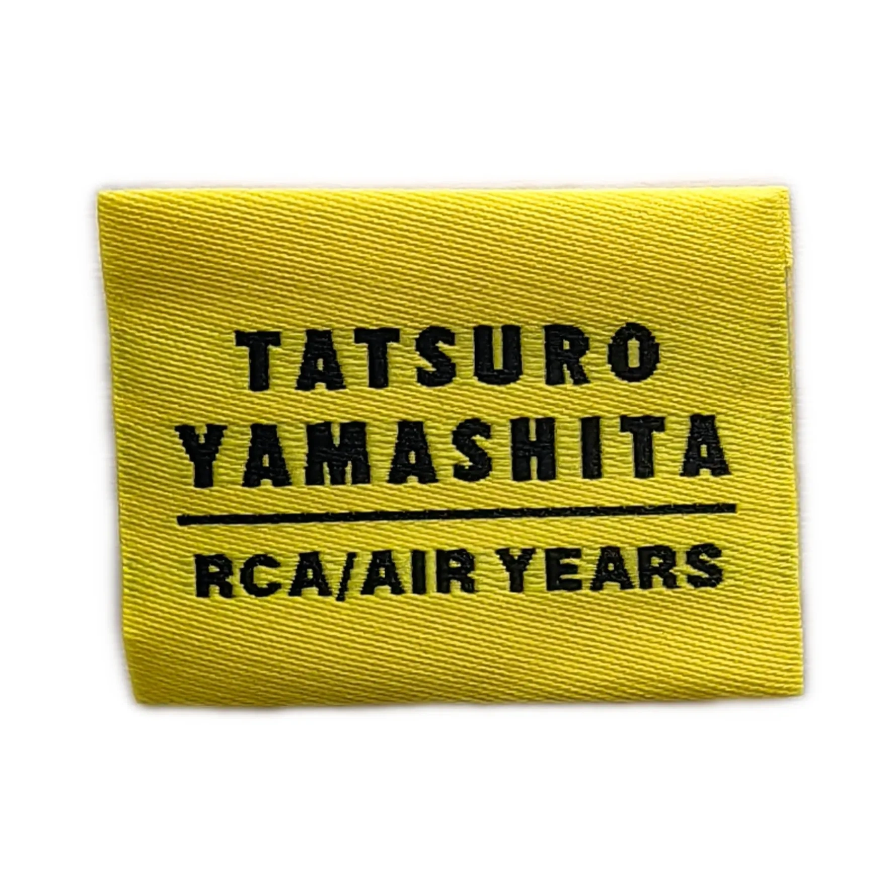Tatsuro Yamashita RCA/AIR Years woven label with hot cut edge and center fold for apparel branding