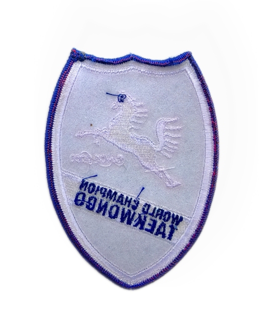 World Champion Taekwondo Embroidered Patch – Blue Shield with Jumping Horse Logo-Back Side
