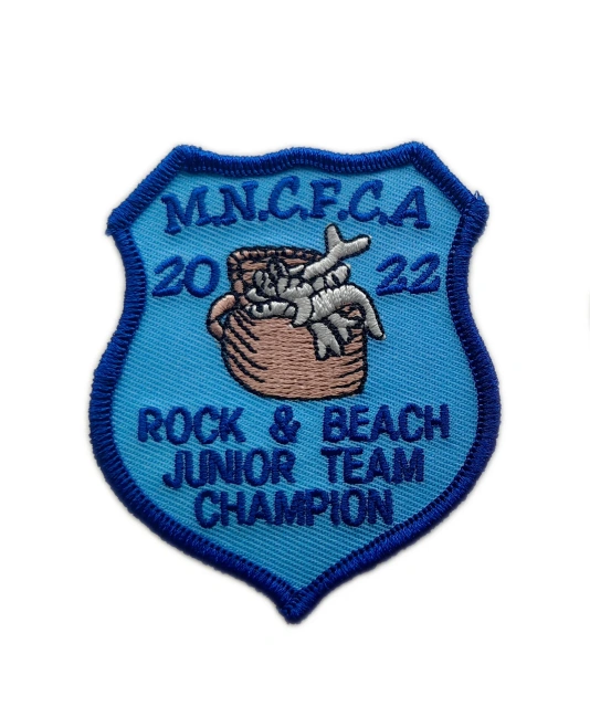 MNCFCA 2022 Rock & Beach Junior Team Champion Embroidered Patch – Blue Shield Design-Front Side