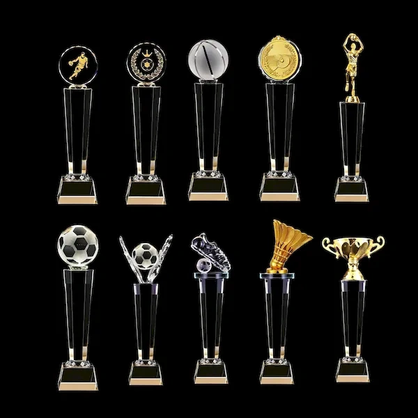 Collection of elegant crystal sports trophies for soccer, basketball, and badminton with black crystal pillars and clear bases.
