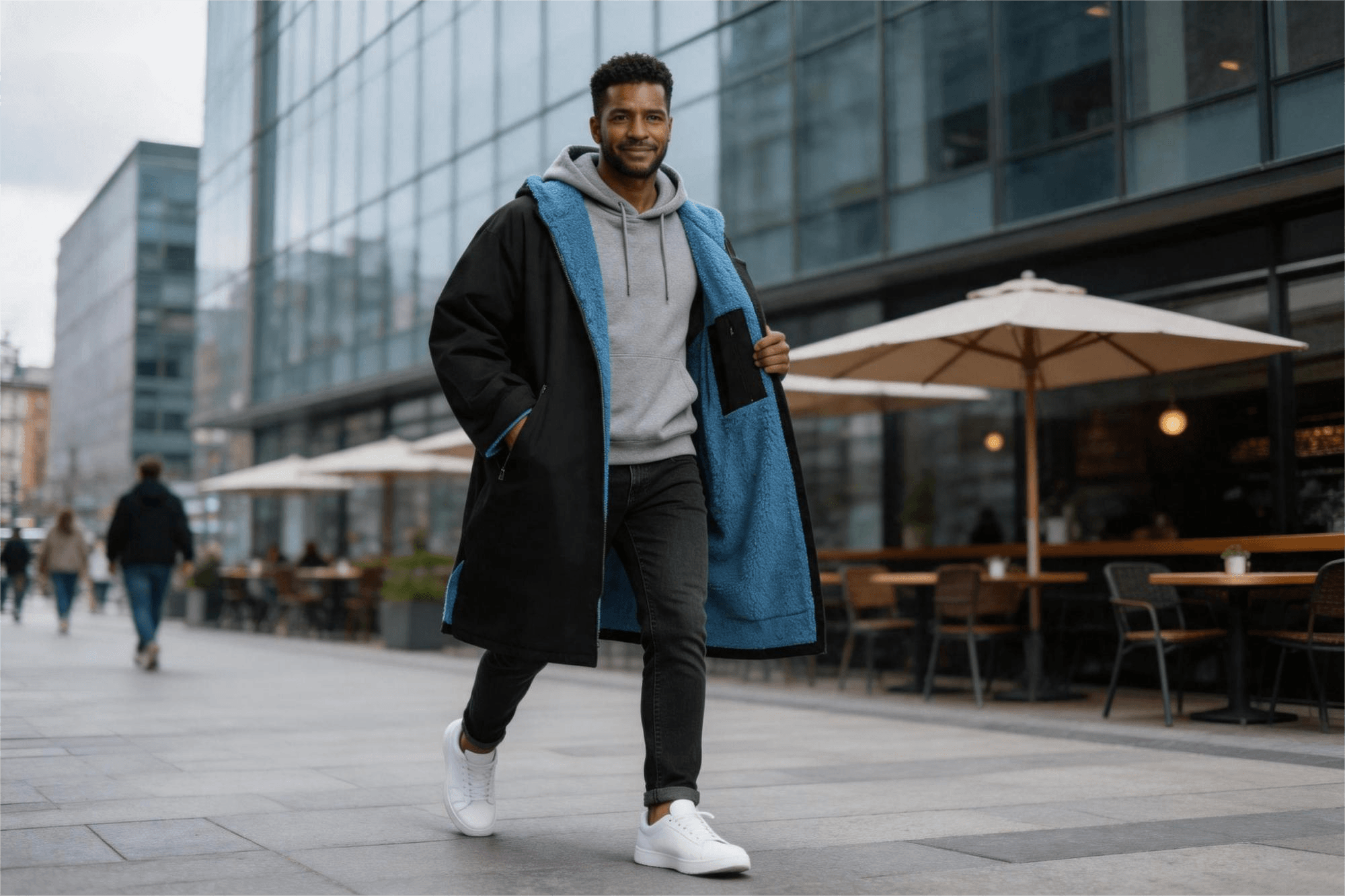 Man in black changing robe street style