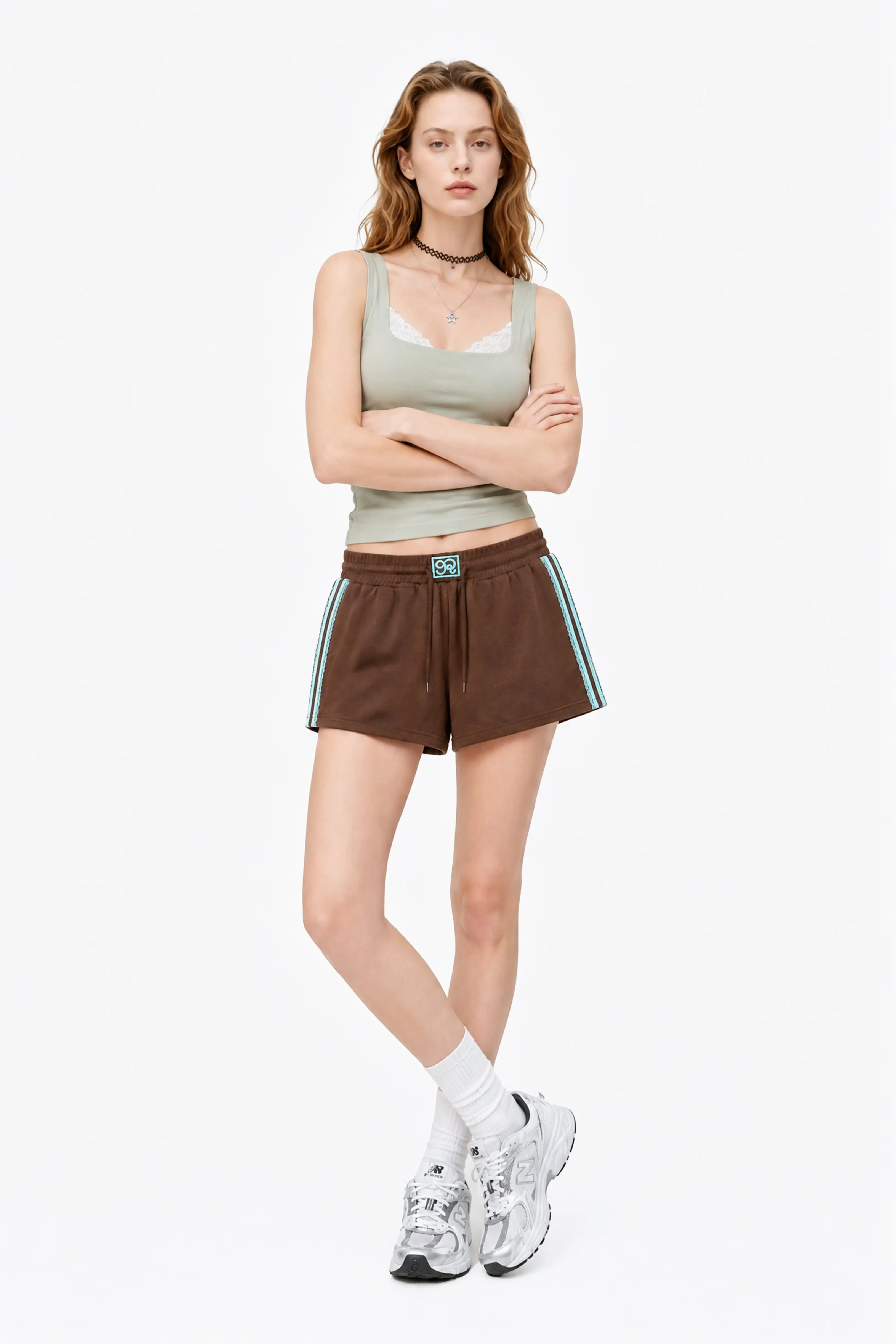 Woman wearing lace trim cotton sweat shorts showing relaxed fit and sporty style