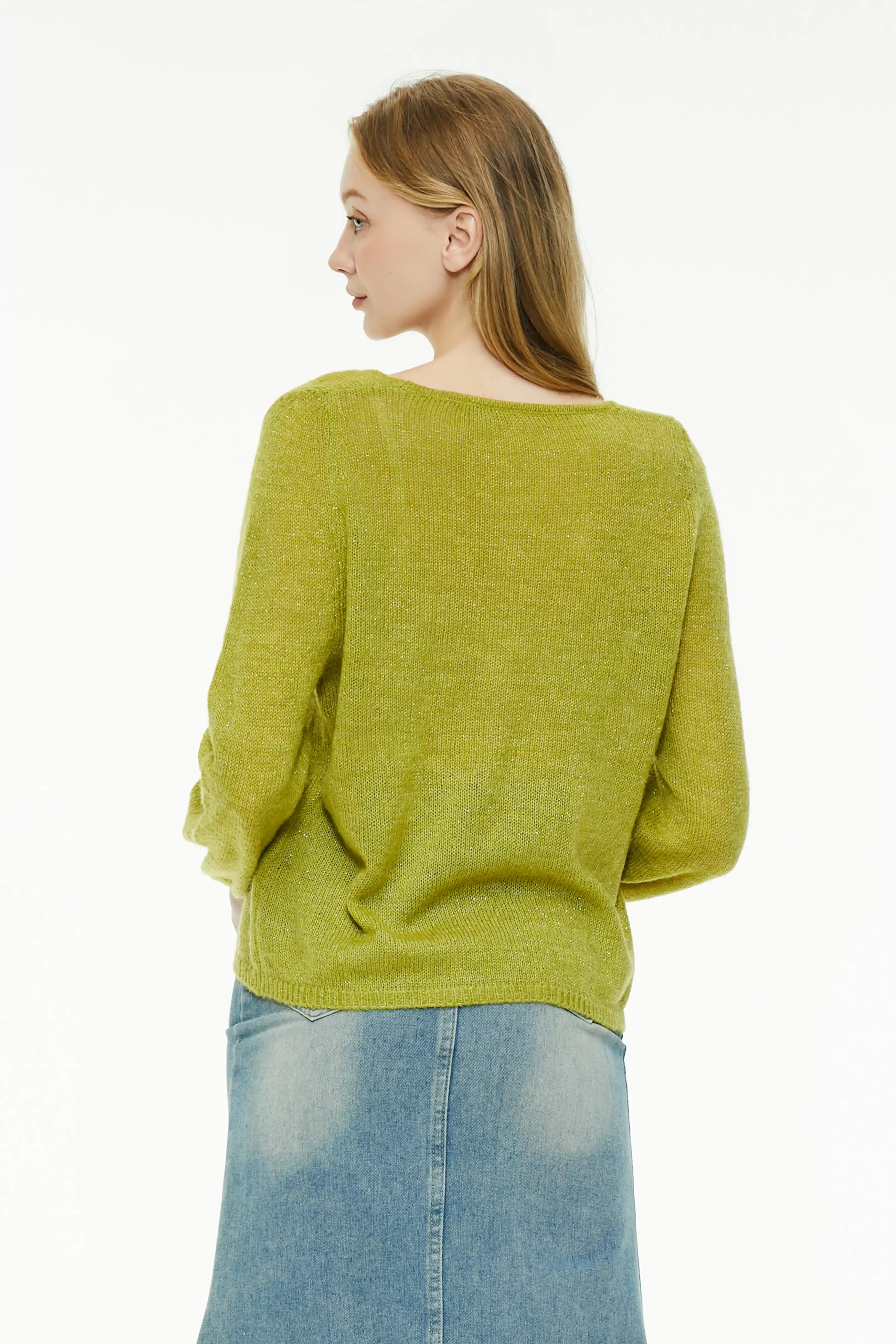Back view of a chartreuse loose knit sweater showing a relaxed drape